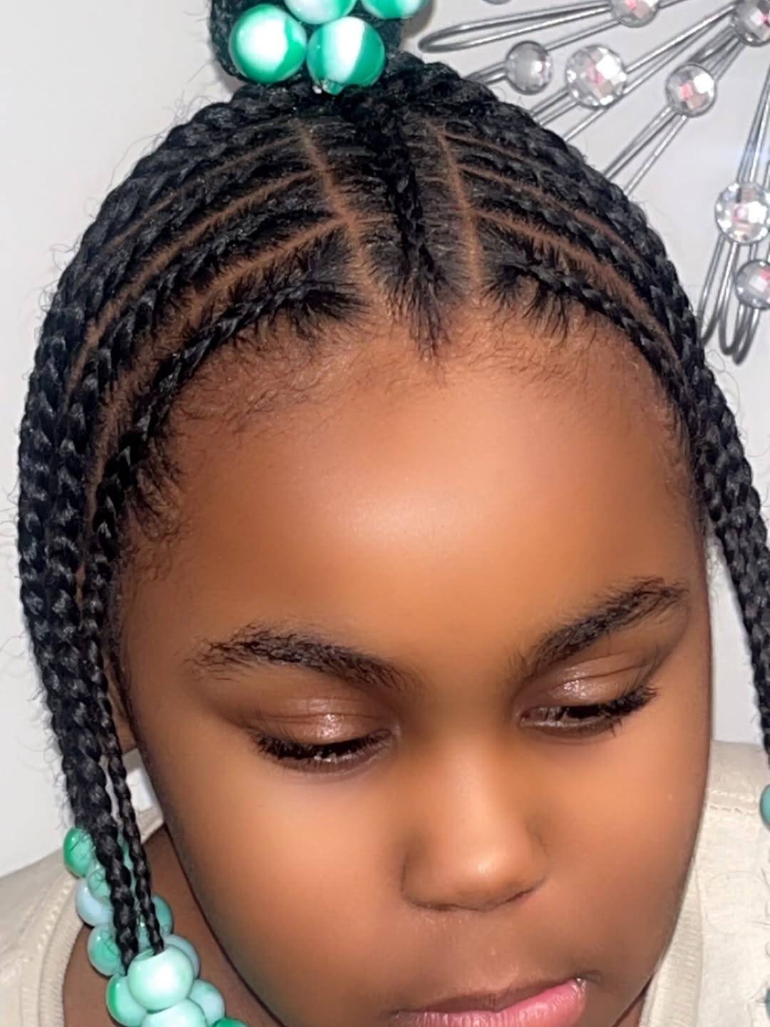 Neat cornrows with beads, braided at Beauty Palace