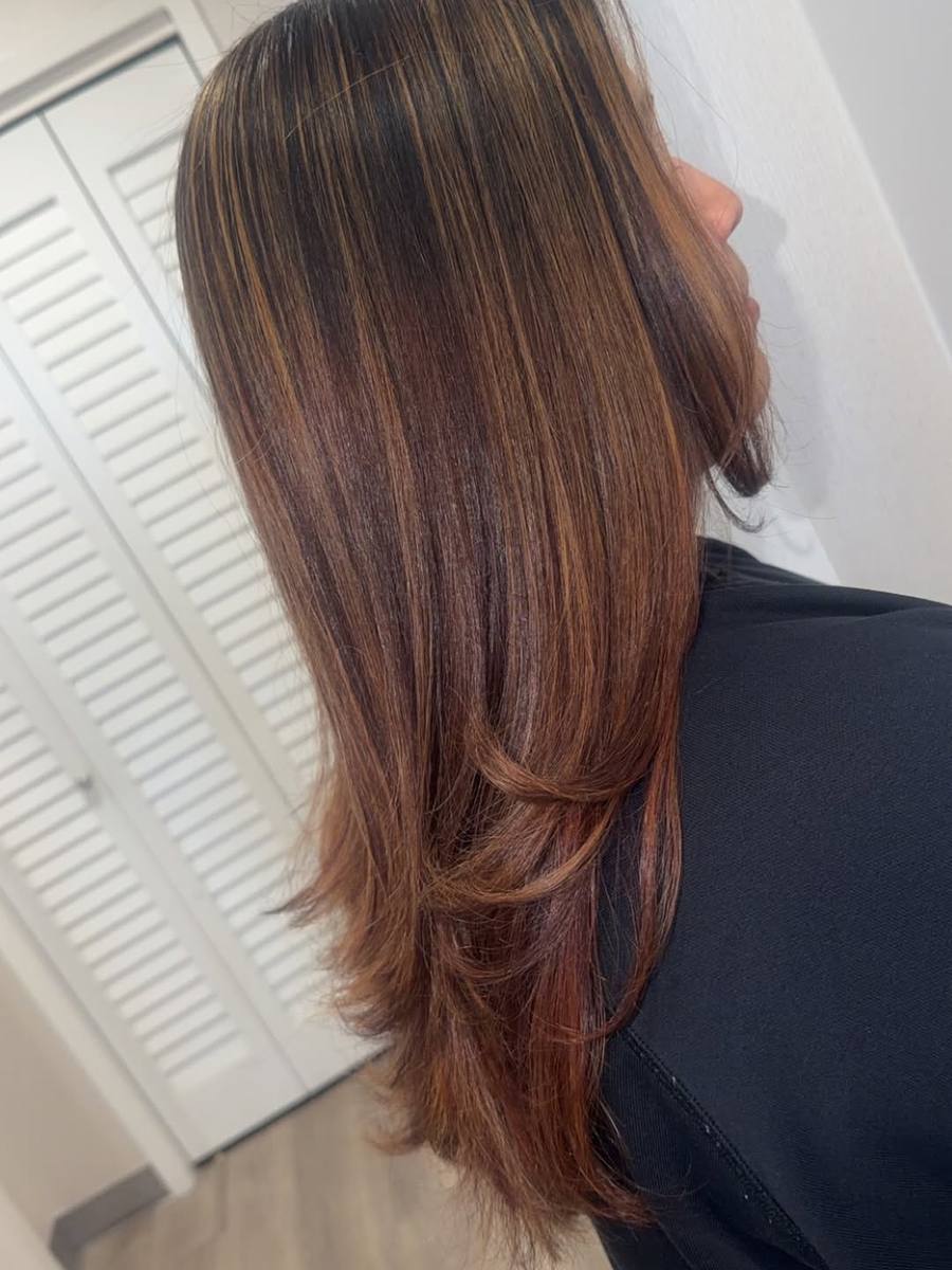 Silk press with highlights, fresh out of Chelsea's chair at Beauty Palace